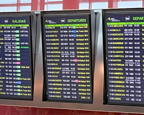 Departures board at Malaga airport. Direct flights to Spain from the US now include NYC-Malaga route